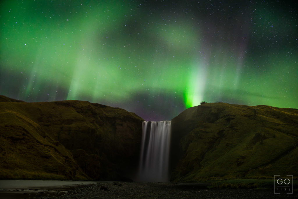 Auroras over Skogafoss, Iceland